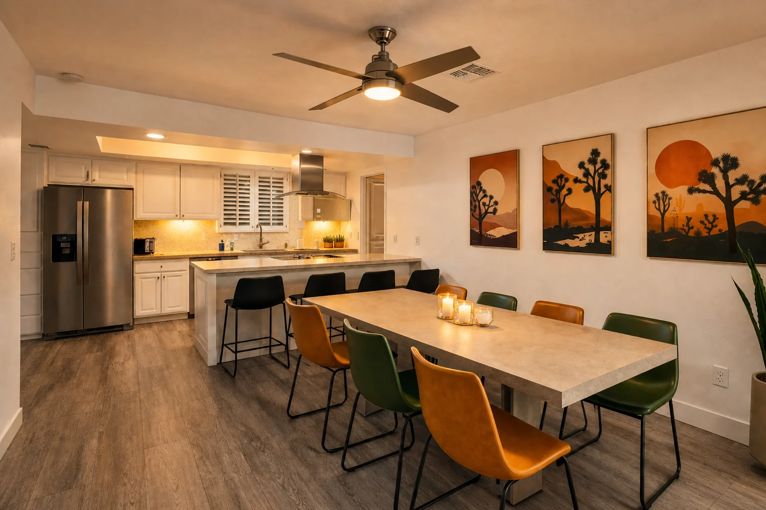 Warm twilight view of the kitchen and dining area